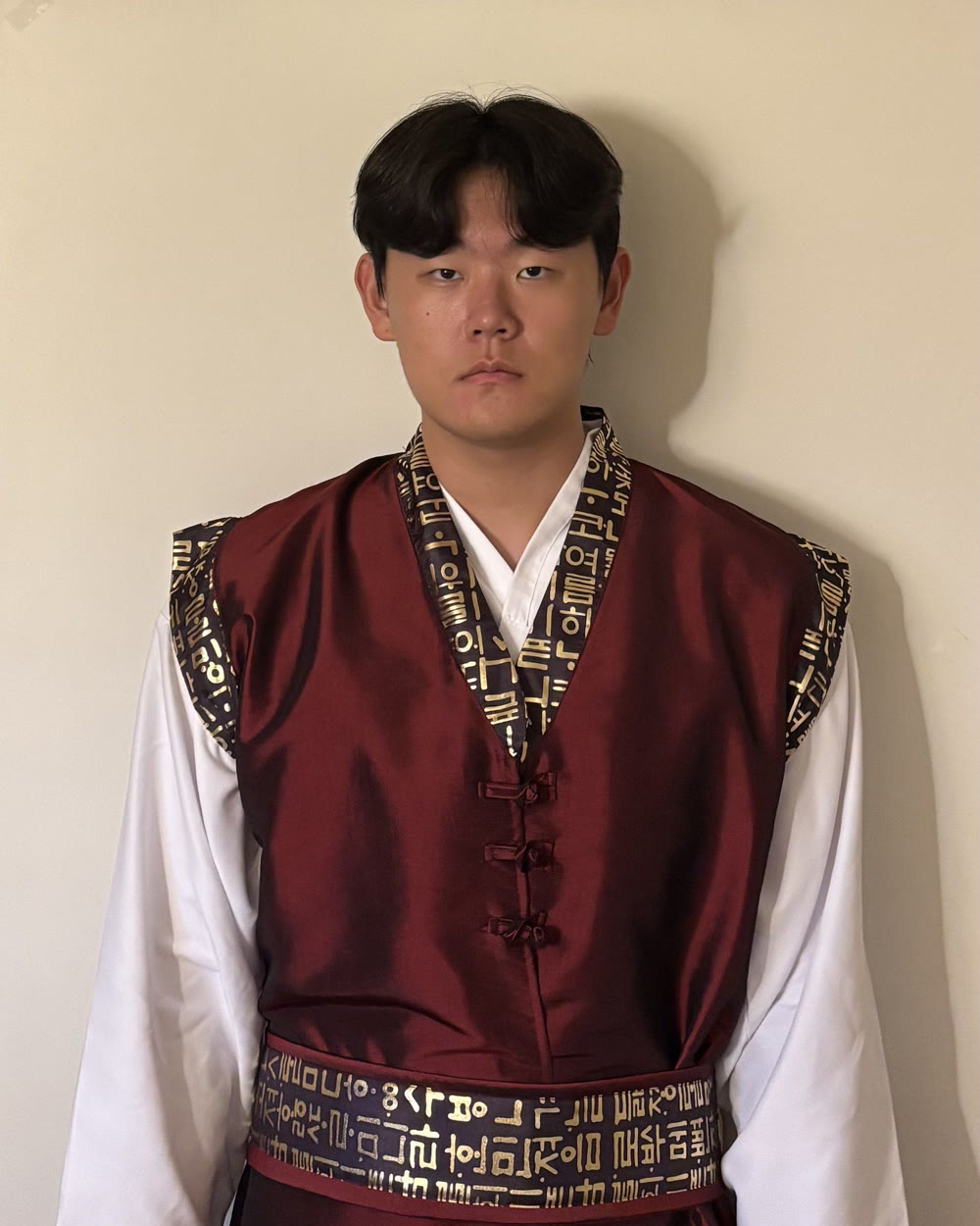Eugene Lim wearing a traditional Korean performance uniform